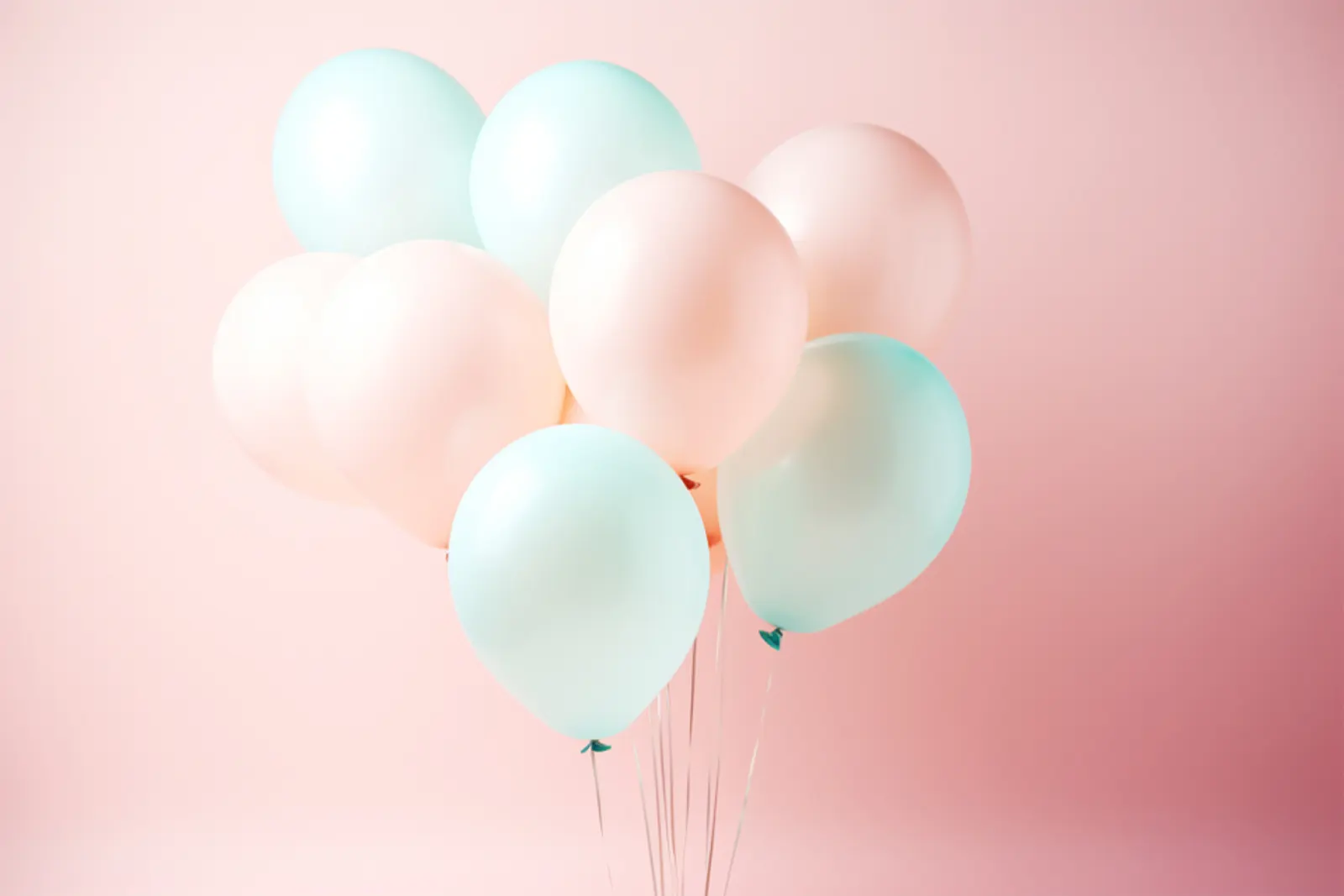 Elegant pastel organic half-arch balloon garland in mint green, baby blue, lavender, and soft yellow with gold moon and star foil balloons at a baby shower in El Paso, TX — Sweet n' Sassy Creations