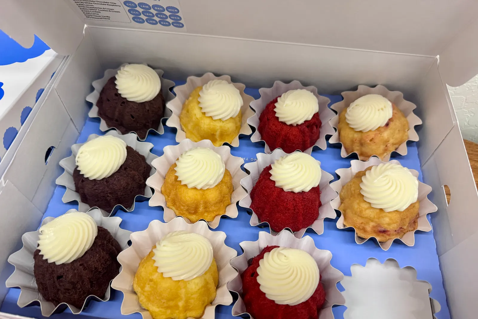 Six homemade individual bundt cakes in lemon, chocolate, strawberry, and red velvet flavors at a Sweet n' Sassy Creations birthday party in Sunland Park near El Paso TX
