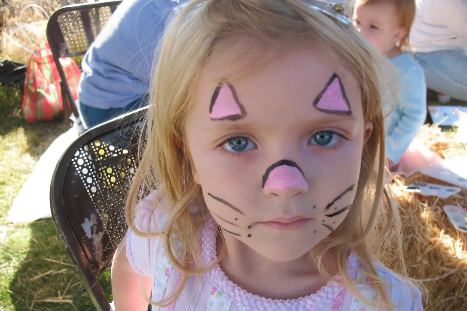 Close-up of a child's face with an intricate unicorn horn face paint design by Sweet n' Sassy Creations at a birthday party in Westside El Paso TX