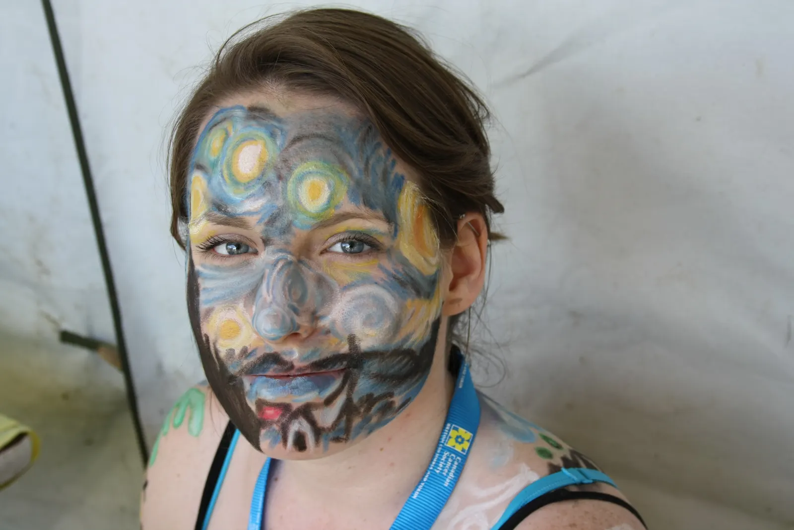 Professional face painting artist creating a butterfly design on a child at a Sweet n' Sassy Creations event near El Paso International Airport, El Paso TX